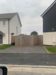 a house and a fence in a yard at Entire 3bed house close to westward ho/ town in Bideford
