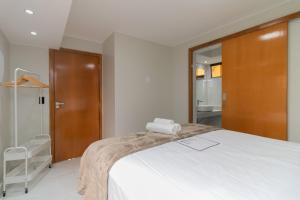 Llit o llits en una habitació de Residencial Oliveiras - Apartamento 2