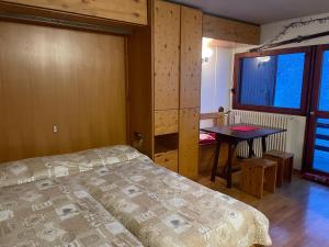 Ένα ή περισσότερα κρεβάτια σε δωμάτιο στο Cervinia On the slopes - I Dadi 603 B