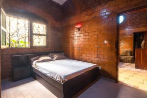 Ліжко або ліжка в номері Villa Gaudi (Gaoudi)