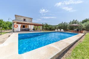 a villa with a pool and a house at Villa Roqueta by Sealand Villas in Pollença