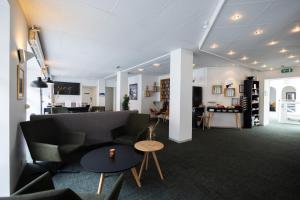 Uma área de estar em Milling Hotel Gestus