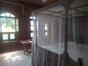 Konkan Nest Resort客房内的一张或多张床位