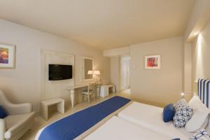 a hotel room with a bed and a desk at Iberostar Selection Diar El Andalous in Port El Kantaoui