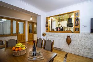 a dining room with a table with fruit on it at Cozy Apartment on Kostava in Tbilisi City