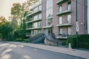 an apartment building with stairs in front of it at Appartement très lumineux de 120m2 in Brussels