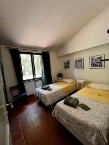 מיטה או מיטות בחדר ב-Holiday Home Serrari