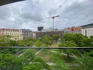 a view of a city with a crane and buildings at Lux.41 in Berlin