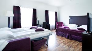 Postel nebo postele na pokoji v ubytování Quality Hotel Grand Steinkjer