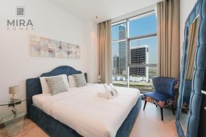Postel nebo postele na pokoji v ubytování Mira Holiday Homes - Serviced 1 bedroom in Business Bay
