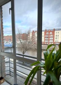 a window with a view of a city street at Riverview Apartment in Dublin