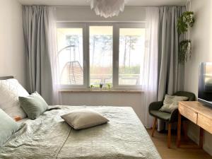 Postel nebo postele na pokoji v ubytování Ferienwohnung Dünensegler