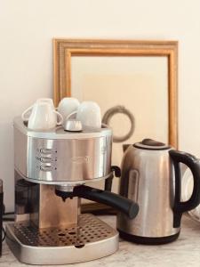 a coffee maker and a tea kettle on a counter at Villa Ermetica in Breil-sur-Roya