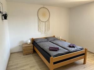 a bedroom with a bed with purple pillows on it at Villa Manuela in Kras +29 photos