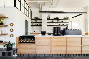 a coffee shop with a counter with aasteryasteryasteryasteryasteryasteryasteryastery at Taylor Haus II - Stylish Stay with Rooftop, Close to Fun in Nashville