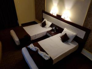 Voodi või voodid majutusasutuse Cairo Paradise Hotel toas