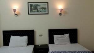 Voodi või voodid majutusasutuse Cairo Paradise Hotel toas