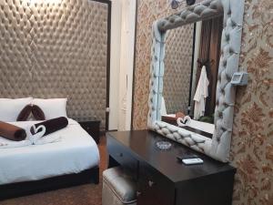 Voodi või voodid majutusasutuse Cairo Paradise Hotel toas