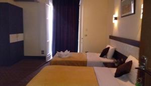 Voodi või voodid majutusasutuse Cairo Paradise Hotel toas