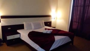 Voodi või voodid majutusasutuse Cairo Paradise Hotel toas