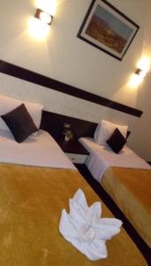 Voodi või voodid majutusasutuse Cairo Paradise Hotel toas