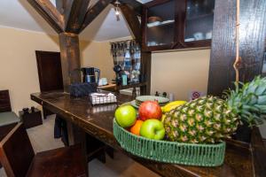 a bowl of fruit on a counter in a kitchen at Casa Mimi in Buşteni