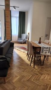a living room with a table and a couch at Apartment 1905 in Tbilisi, Avlabari in Tbilisi City