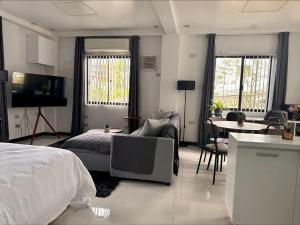 TV a/nebo společenská místnost v ubytování GIA's Place