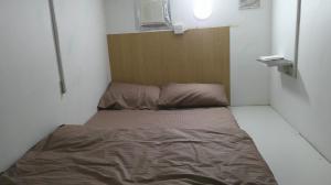 a small bedroom with a bed in a room at Ruby Star Hostel Loft Bed 21 in Dubai