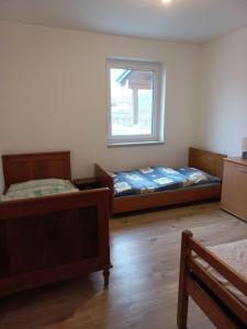Łóżko lub łóżka w pokoju w obiekcie Ferienwohnung