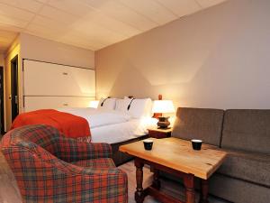 Hunderfossen Hotel & Resort tesisinde bir odada yatak veya yataklar