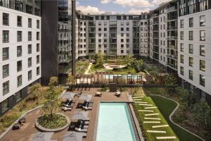an aerial view of the courtyard of a building with a pool at Marriott Executive Apartments Johannesburg, Melrose Arch in Johannesburg