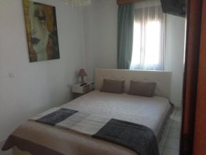 Postel nebo postele na pokoji v ubytování Snuggery Elegant Apartment
