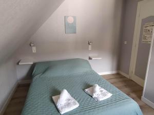 Postel nebo postele na pokoji v ubytování Hôtel restaurant Notre Dame
