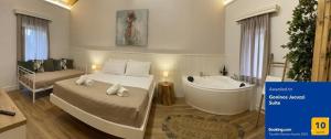 Voodi või voodid majutusasutuse Goninos Jacuzzi Suite toas