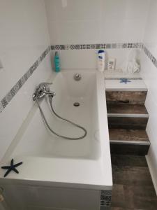 a bathroom with a sink and a faucet at Le Refuge de Manou in Saint-Péray +11 photos