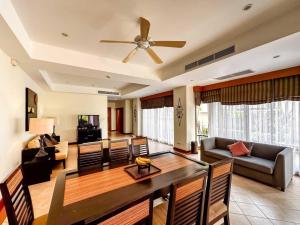 a dining room and living room with a ceiling fan at 3Bed Villa - Sleeps 6 - Pool Garden Balcony in Layan Beach