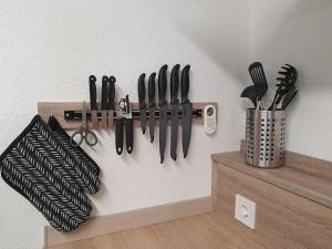 a bunch of knives hanging on a wall at Fuchsbau Haasow in Haasow