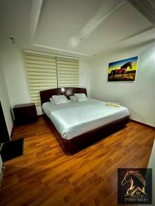 a bedroom with a large bed in a room at Hacienda en Chia in Chía