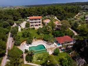 an aerial view of a house with a swimming pool at Sanidiamonds in Sani Beach