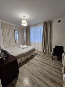 a bedroom with a bed and a large window at Dublin Exchange Suites in Dublin