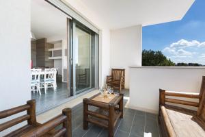 Posedenie v ubytovaní Appartamento dell'Aurora by Le Dune Villas