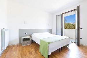 Posteľ alebo postele v izbe v ubytovaní Appartamento dell'Aurora by Le Dune Villas