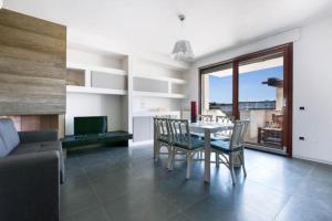 Posedenie v ubytovaní Appartamento dell'Aurora by Le Dune Villas