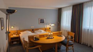 Postel nebo postele na pokoji v ubytování Hotel Gasthof Lang