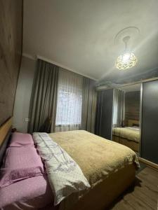 Postel nebo postele na pokoji v ubytování Guesthouse Tornike