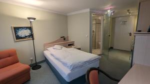 En eller flere senger på et rom på Hotel Gasthof Lang