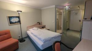 Postel nebo postele na pokoji v ubytování Hotel Gasthof Lang