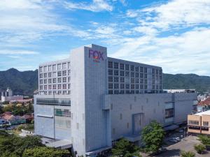 a fox building with the fox logo on it at FOX Hotel Gorontalo in Gorontalo