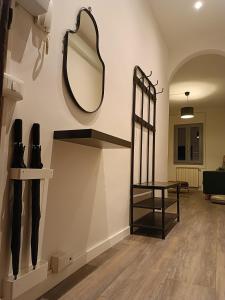 a dressing room with a mirror and a table at Corso Italia in San Giovanni Valdarno